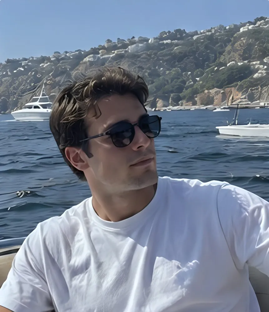 Terra Chad on a boat, white t-shirt, sunglasses