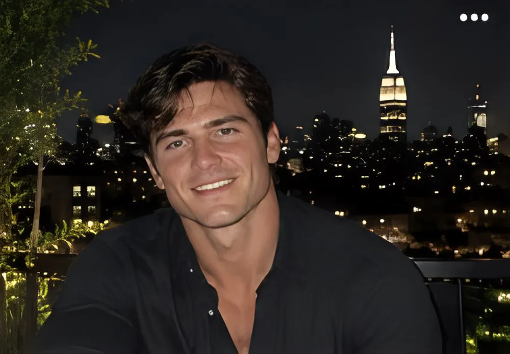 Josh, 5 foot 6, played by Terra Chad, on a New York rooftop at night
